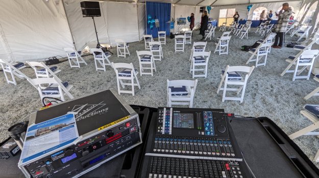 Audio mixer and equipment setup at groundbreaking ceremony