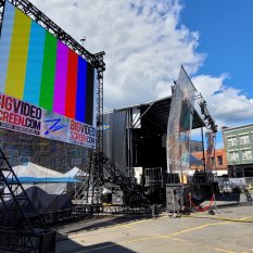 LED wall with color bars test pattern at a music festival