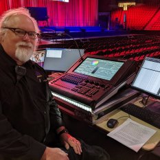 Lighting console operator in arena