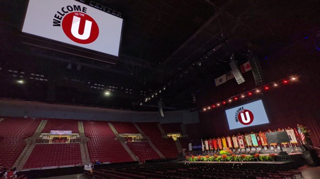 University event in arena with large LED wall