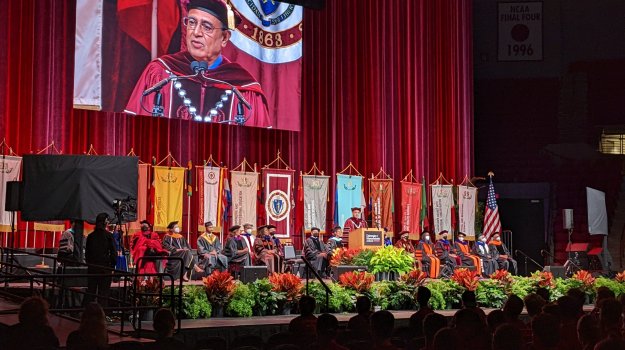 University event in arena with large LED wall