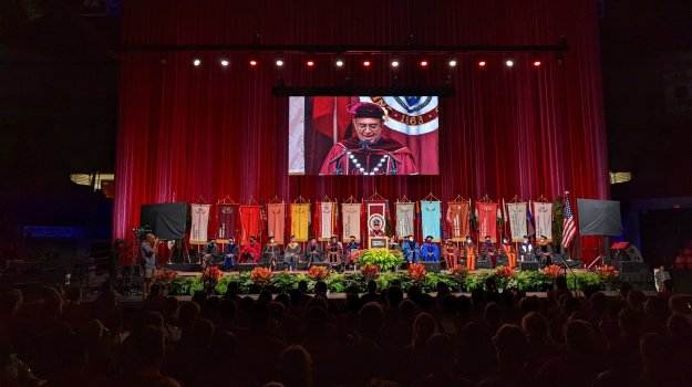 University event in arena with large LED wall