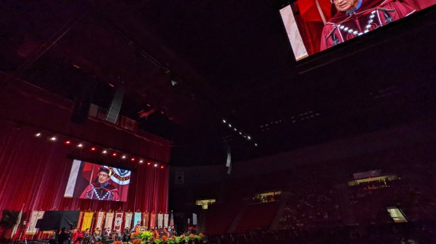 University event in arena with large LED walls