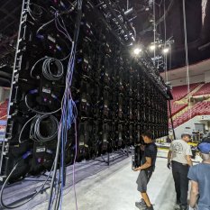Crew building LED video wall in arena