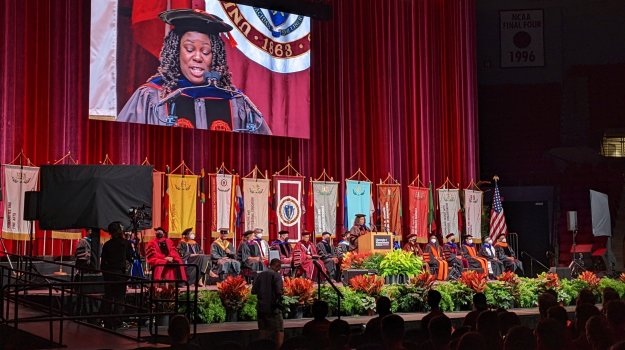University event in arena with large LED wall