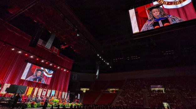 University event in arena with large LED walls