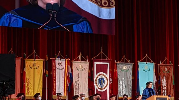 University event in arena with large LED wall